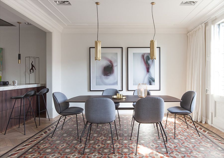 dining room by YLAB Arquitectos with grey chairs and golden pendant lights