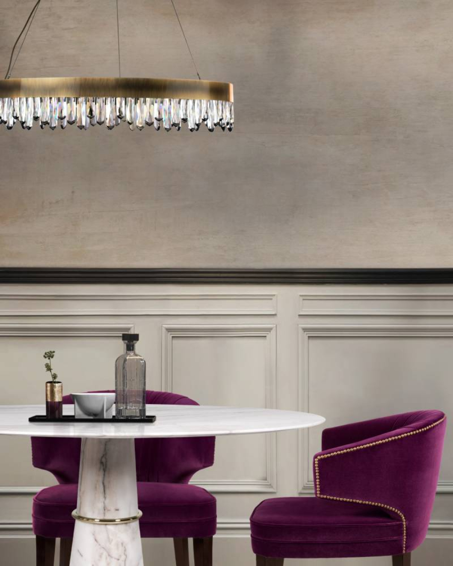 dining room by brabbu with white marble table and purple velvet chairs